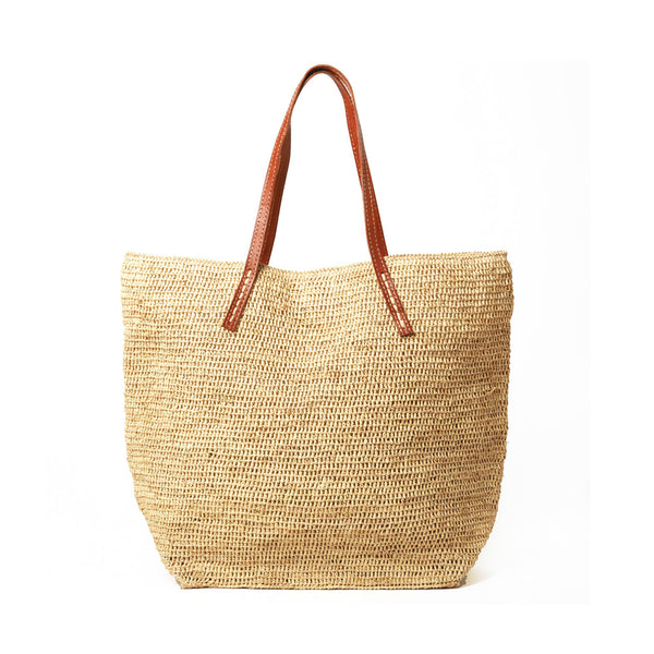 Natural colored crocheted carryall with snap closure, cotton lining & leather straps