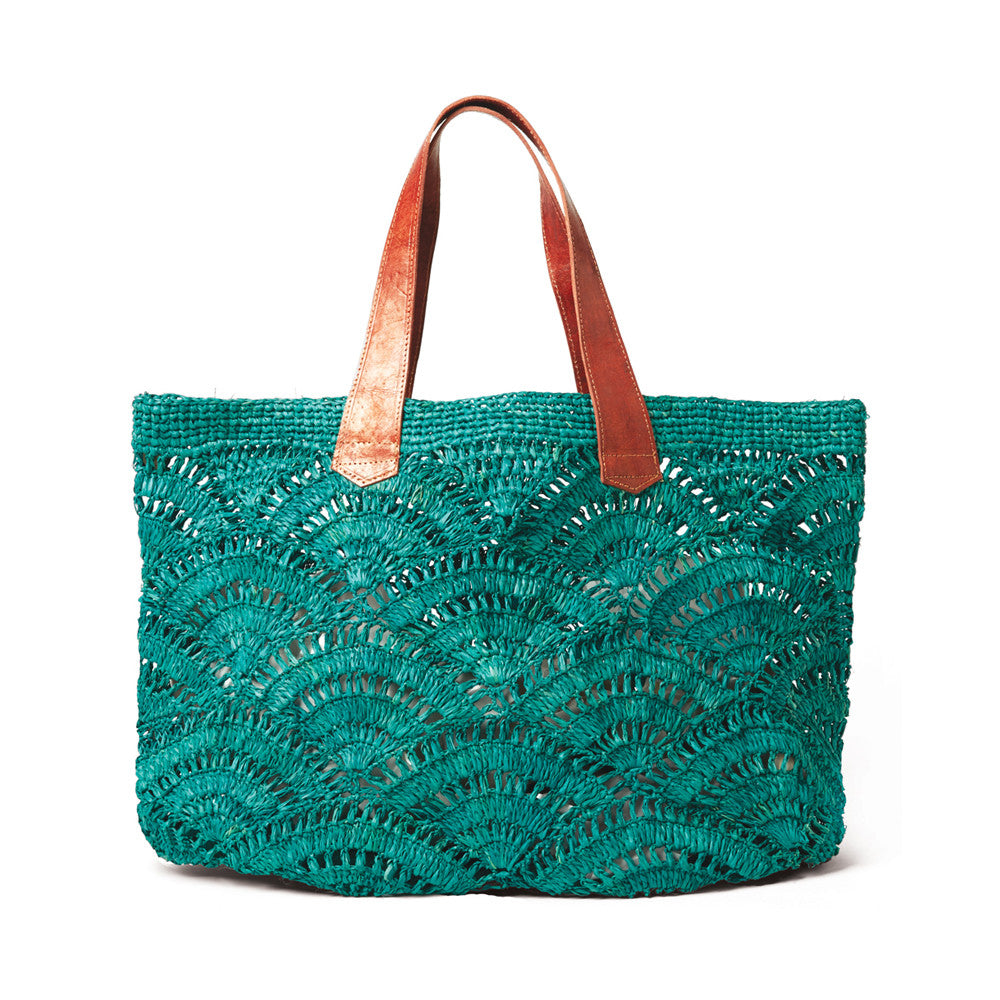 Aqua colored crocheted open weave carryall with leather handles