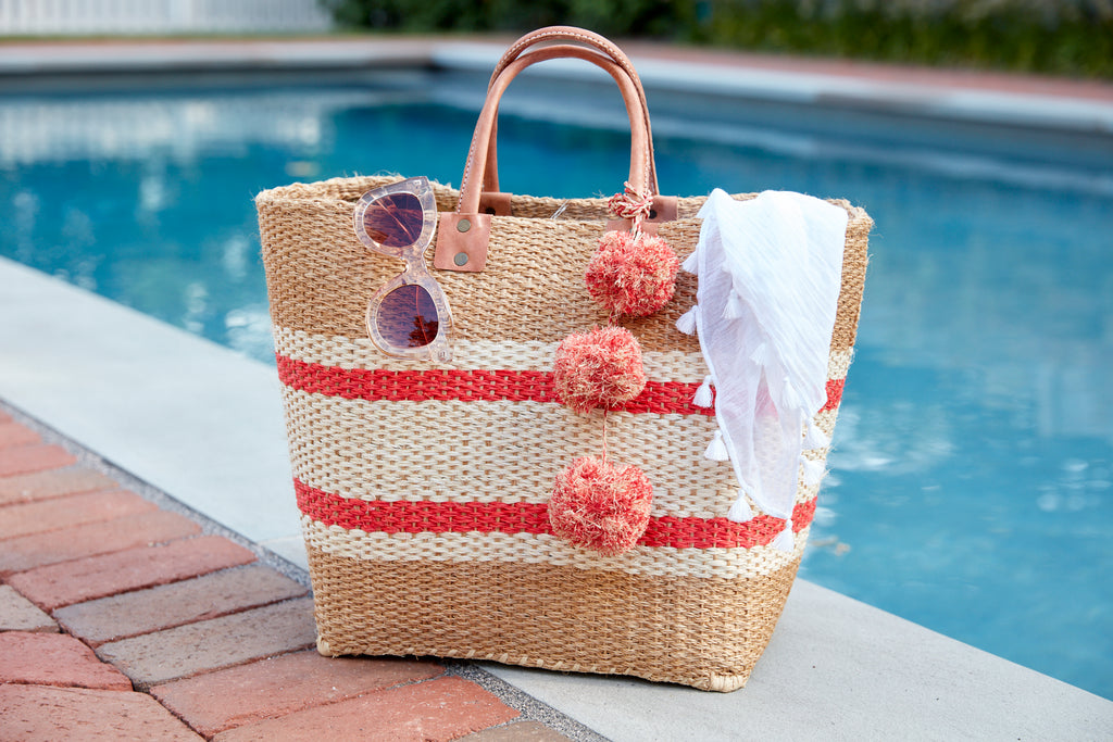 Cyprus Coral sitting poolside with accessories inside