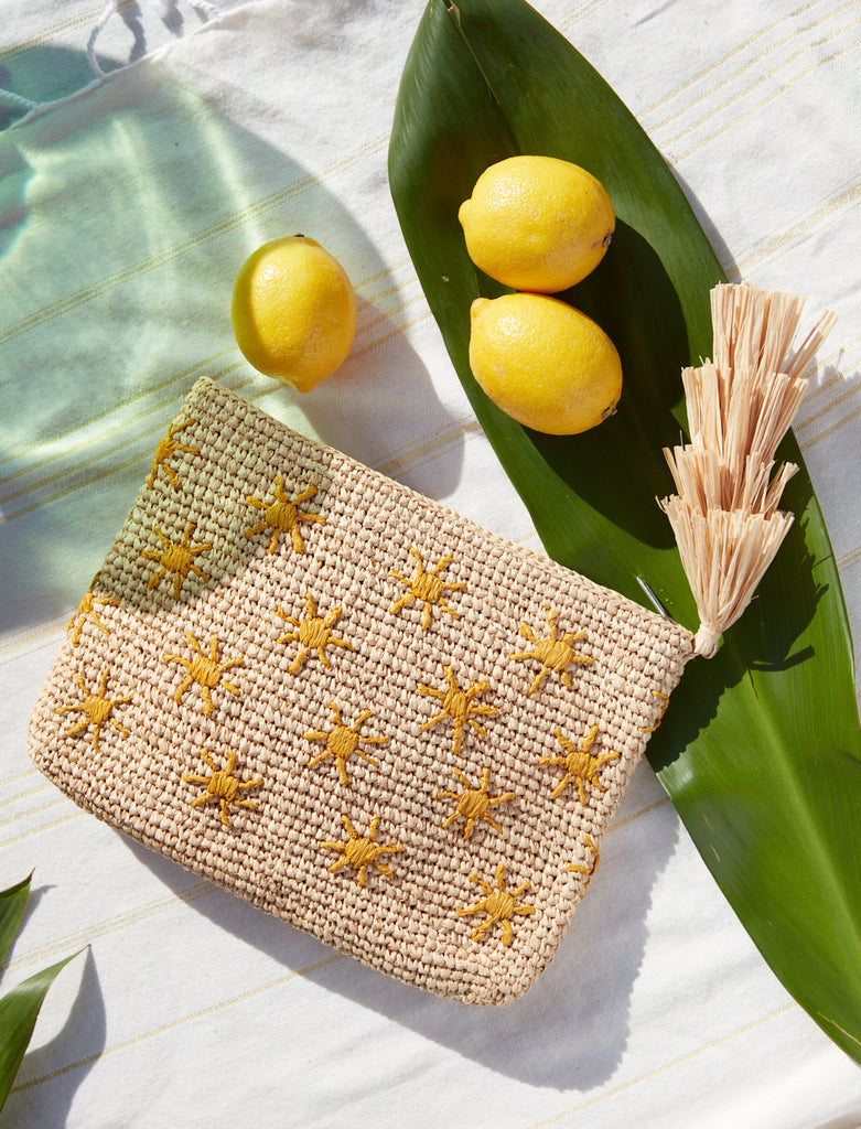 Soleil clutch with lemons and a leaf