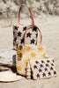 Petite Amelie tote with Petite Soleil Tote and Estrella clutch on the beach
