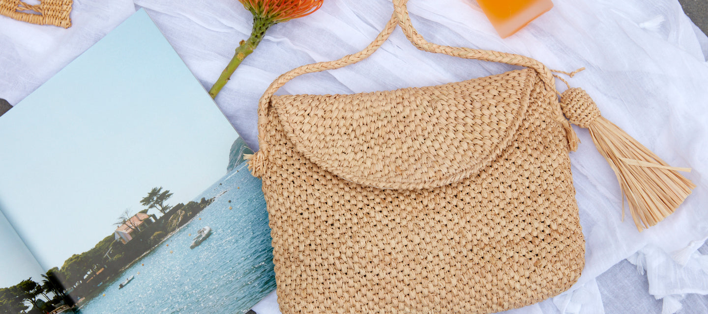 June crossbody on a towel with accessories