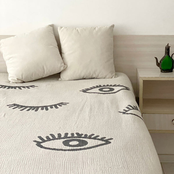 Visions throw spread on a bed