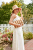 Model in a garden wearing Eleni Sand