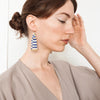 Model wearing earrings with 14k gold ear wires and Japanese glass beads