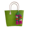 Citron colored woven seagrass and sisal tote with leather handles and multi colored tassel.