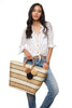 Model on white wearing our Capri tote in Sand