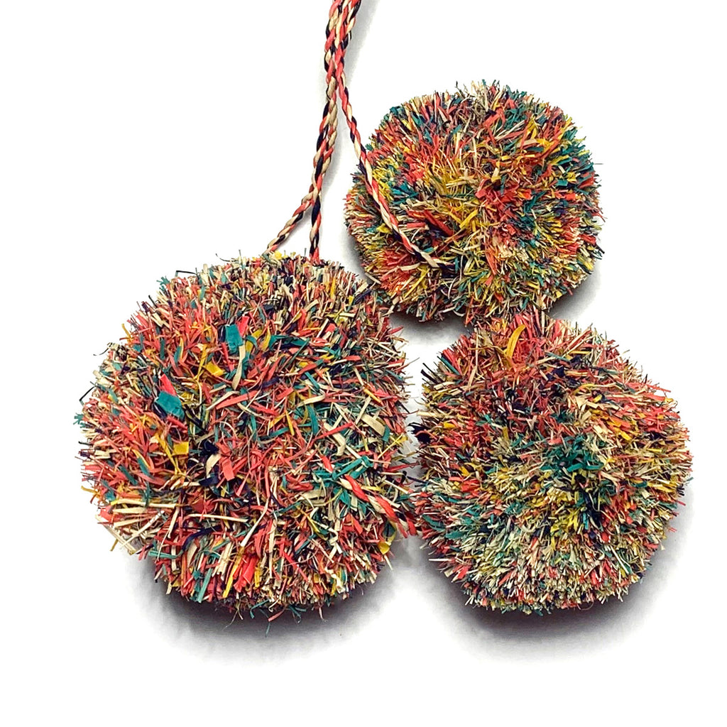 Multi-colored pom poms as used on our Caracas tote.