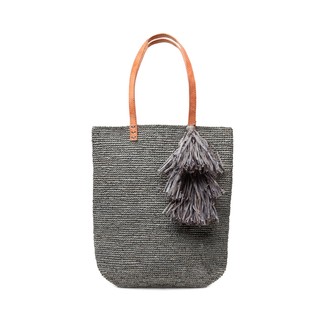 Dove colored crocheted north-south tote with cotton lining, leather straps & removable tassel