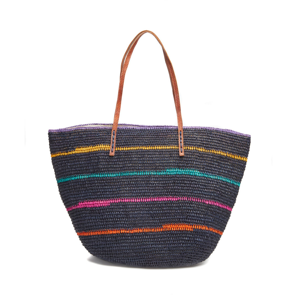 Navy colored raffia tote with multi colored stripes, cotton lining, and leather straps