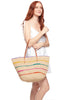 Model holding natural colored crocheted raffia shoulder tote with multi colored stripes