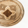 Close up of two handmade Mandala wall baskets in natural and brown colors