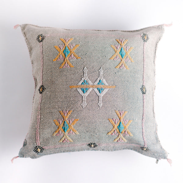 Dove colored square pillow with embroidered design