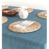 Placemats on Blue table cloth with white napkins set on them