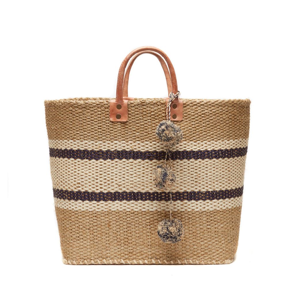 Navy striped woven sisal basket tote with pom poms & leather handles