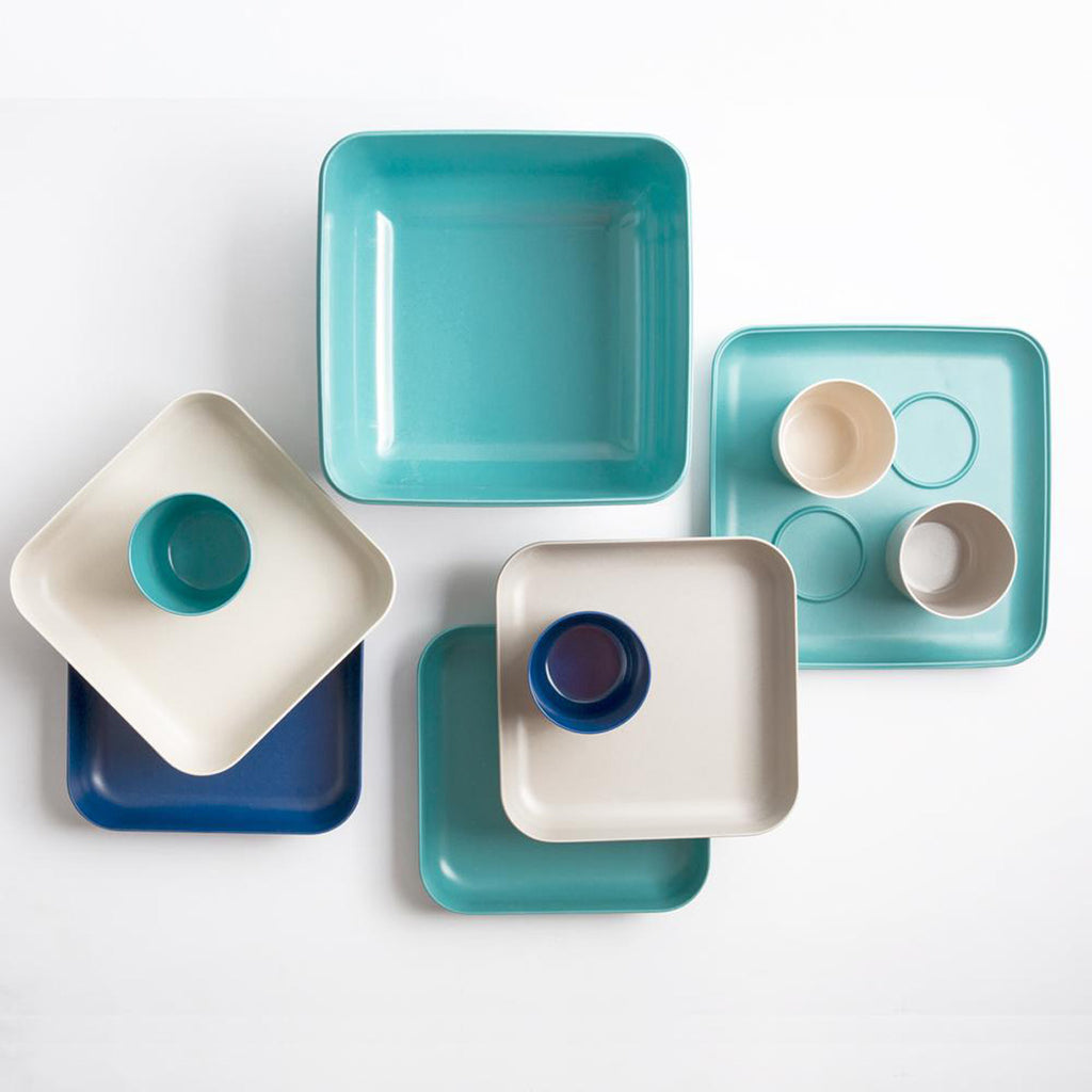 Blue, white, and aqua plates and cups and trays