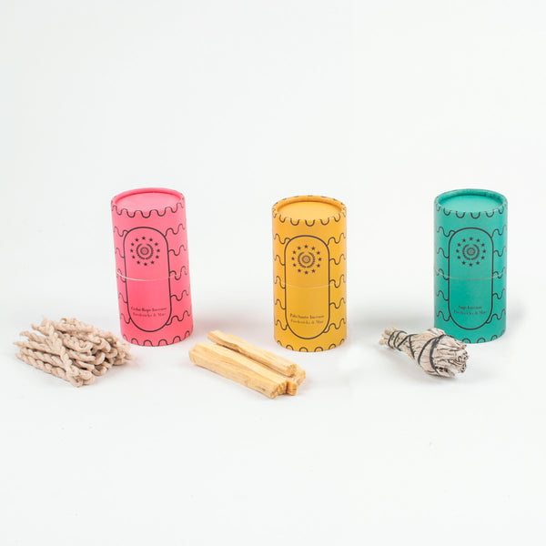 Three different incense piles next to their containers