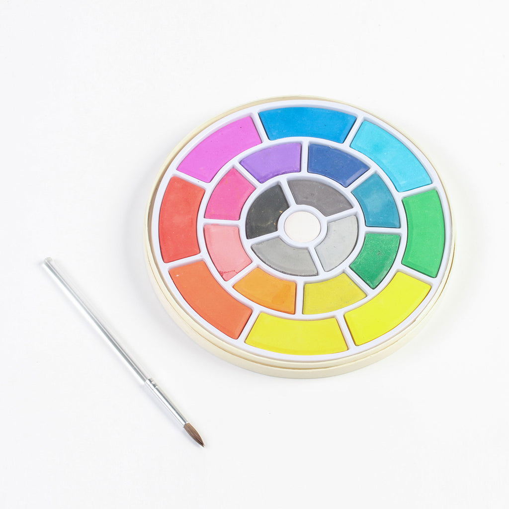 Vibrant water color set in a circular pallet with brush
