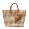 Hadley woven sisal beach tote in Sand color with two natural pom poms and leather handles
