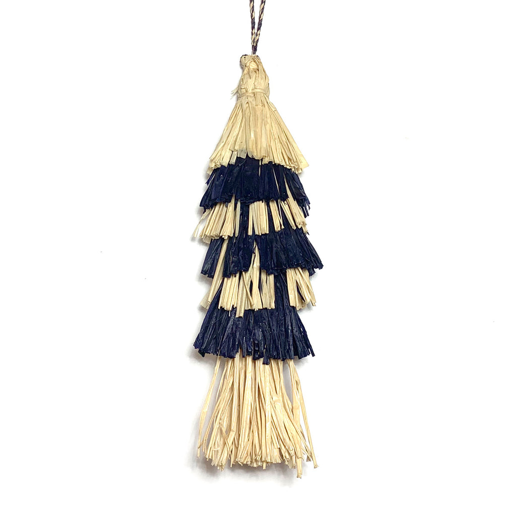 Single natural and navy colored tassel as used on our Ibiza tote