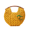 Sunflower colored crocheted raffia clutch with wooden handles, cotton lining, and pineapple charms