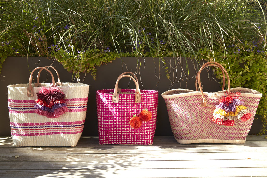 Three totes on a grassy deck Caracas Pink Multi, Hadley Pink and Madrigal Pink