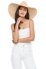 Model wearing natural colored crocheted wide brim sun hat with raffia cord