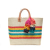 Natural colored, multi-colored striped basket tote with removable tassels and leather handles