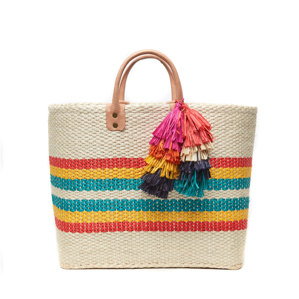 Natural colored, multi-colored striped basket tote with removable tassels and leather handles