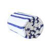 Rolled up white and blue striped beach blanket
