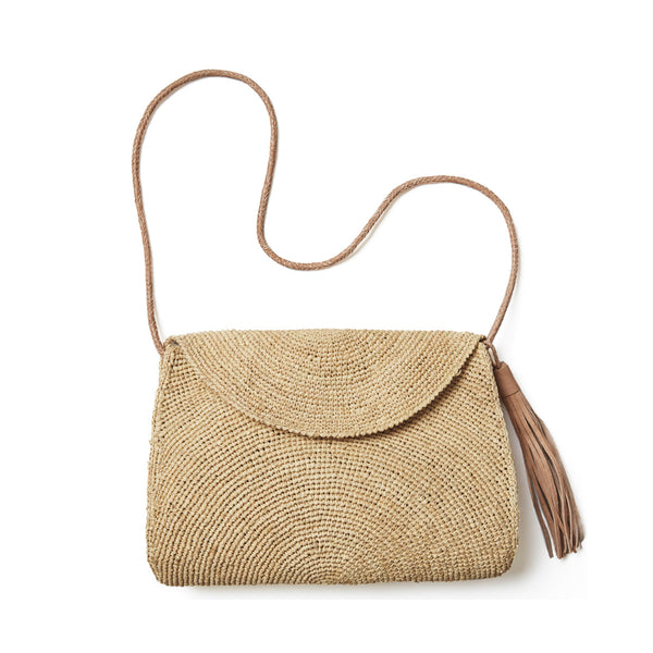 Natural colored crocheted shoulder bag with cotton lining, snap closure, leather strap & tassel
