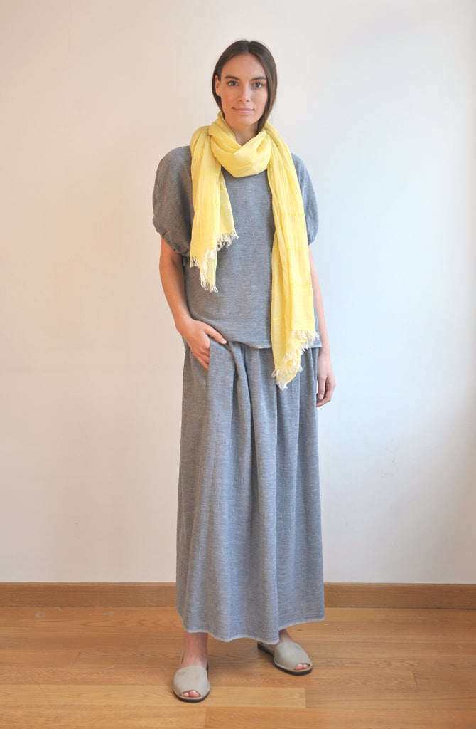 Model wearing handwoven Turkish cotton scarf in yellow