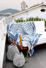 Hand woven Turkish cotton throw in marine and white draped on a sofa