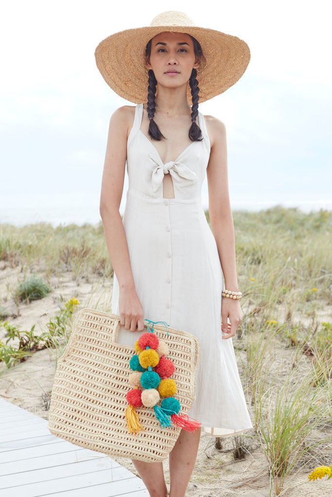 Model on beach with Nola Tote