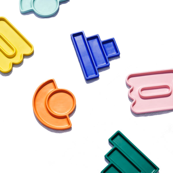 Array of a number of different colored catchall trays