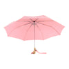 Open pink umbrella with a duck head handle