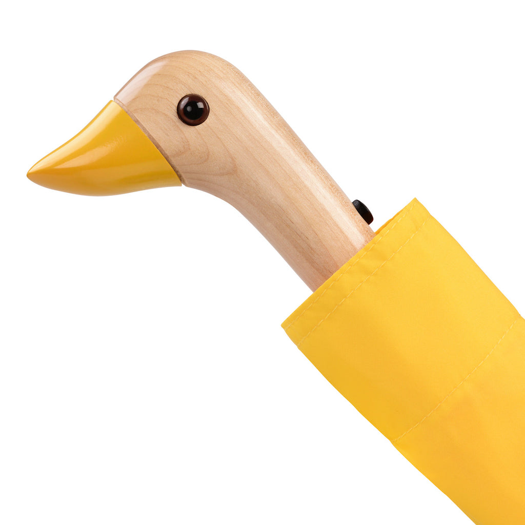Yellow umbrella with a duck head handle