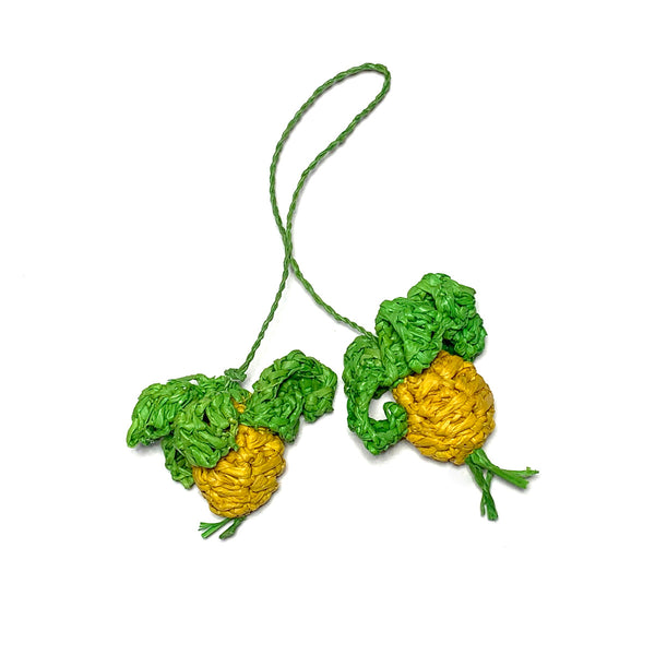 Small pineapple shaped raffia pom poms in yellow with green