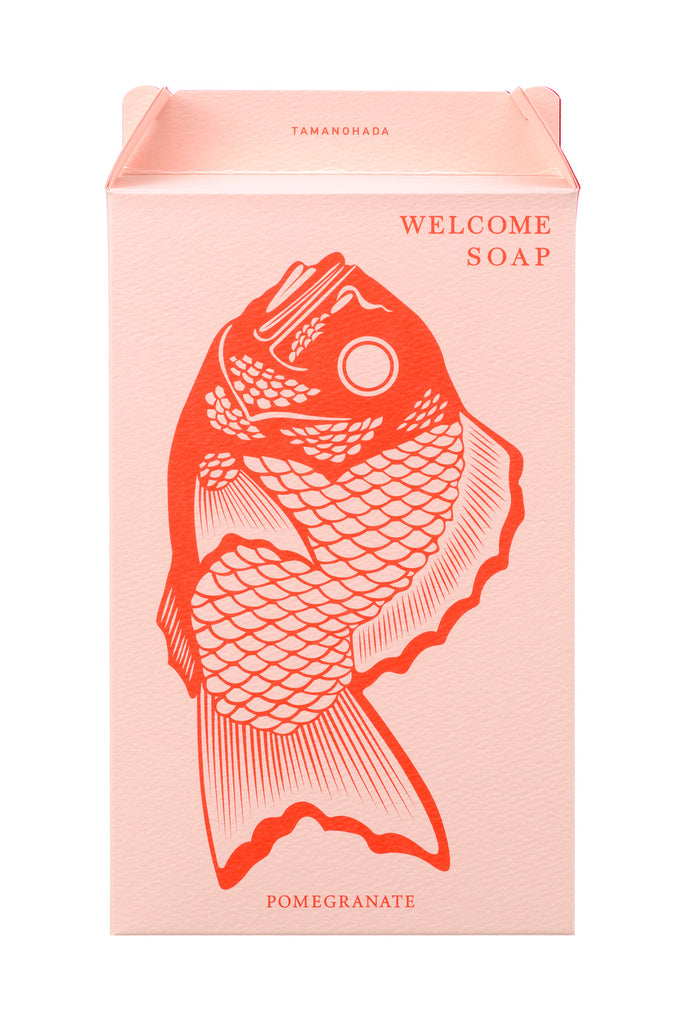Peach colored box with fish image that pomegranate Japanese Welcome Soap comes in