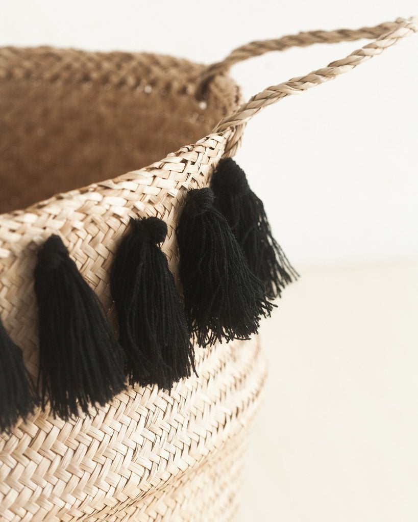 Close up detail of one basket with black tassels