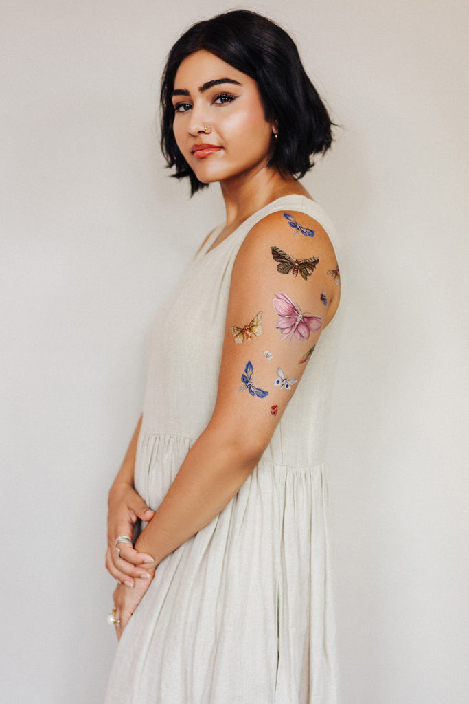 Model wearing Tattly Floraflies tattoos