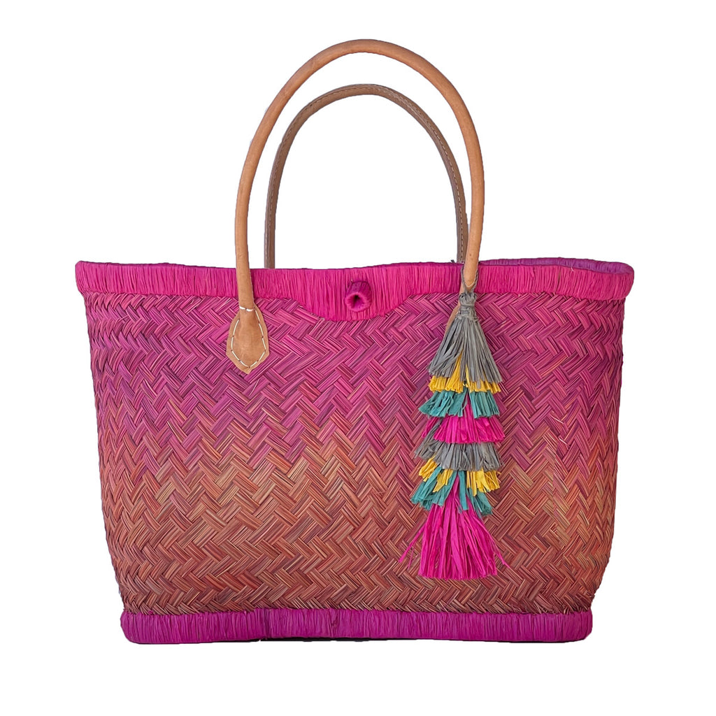 Pink and mango ombre woven basket tote with leather handles and tassel